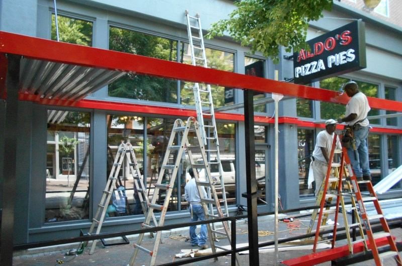 Installing metal canopy at Aldo's Pizza Pies
