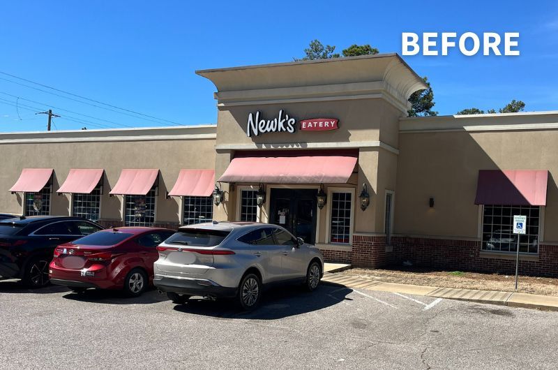 faded awnings on Newk's building front