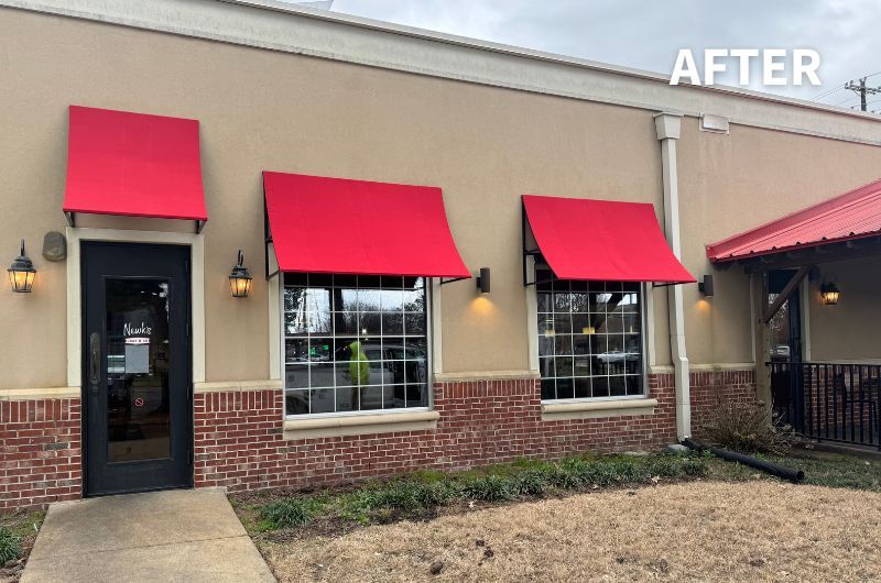 bright red concave awnings over restaurant windows