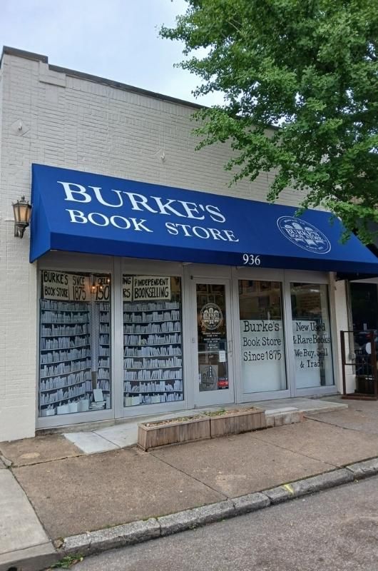 blue awning above storefront Burke's Book Store