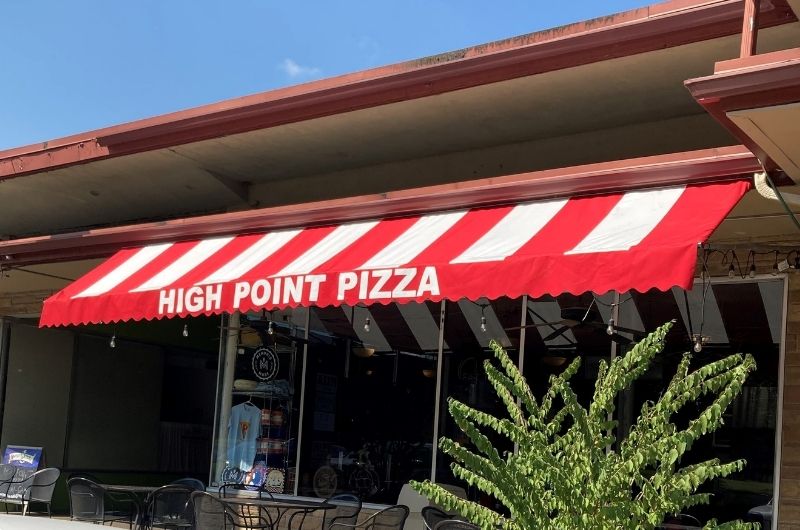 red and white striped fabric awning with valance at High Point Pizza