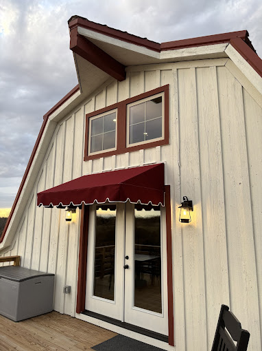 burgundy door awning with scalloped valance