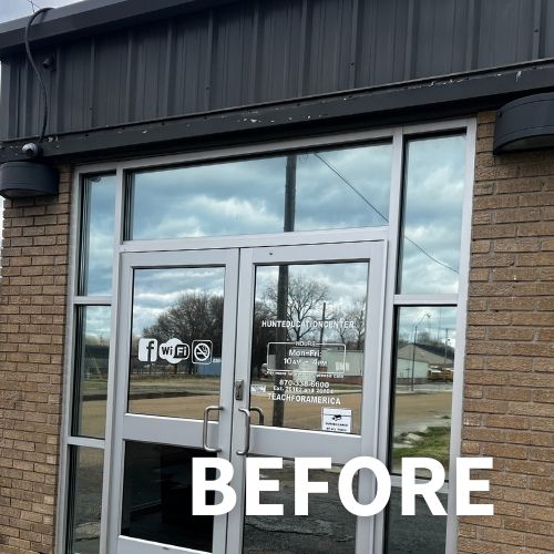 glass entry doors on brick building