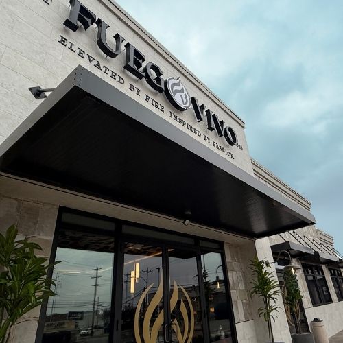 bronze colored canopy suspended over entryway