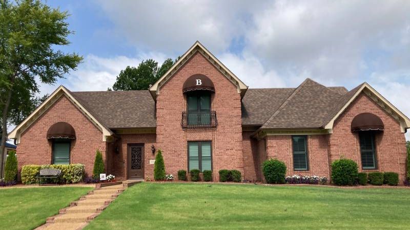 Home with custom dome awning