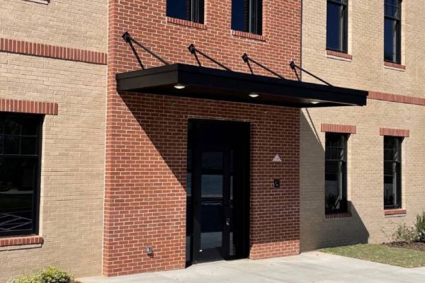 Suspended metal door canopy