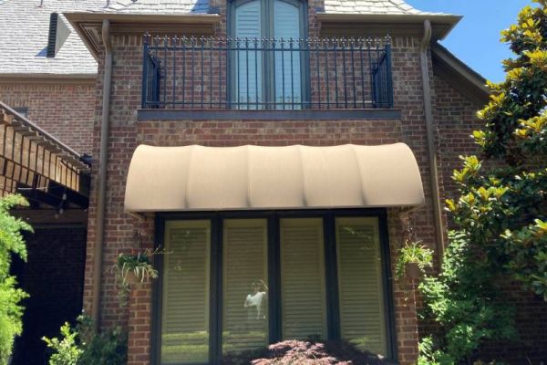 convex fabric awning over windows